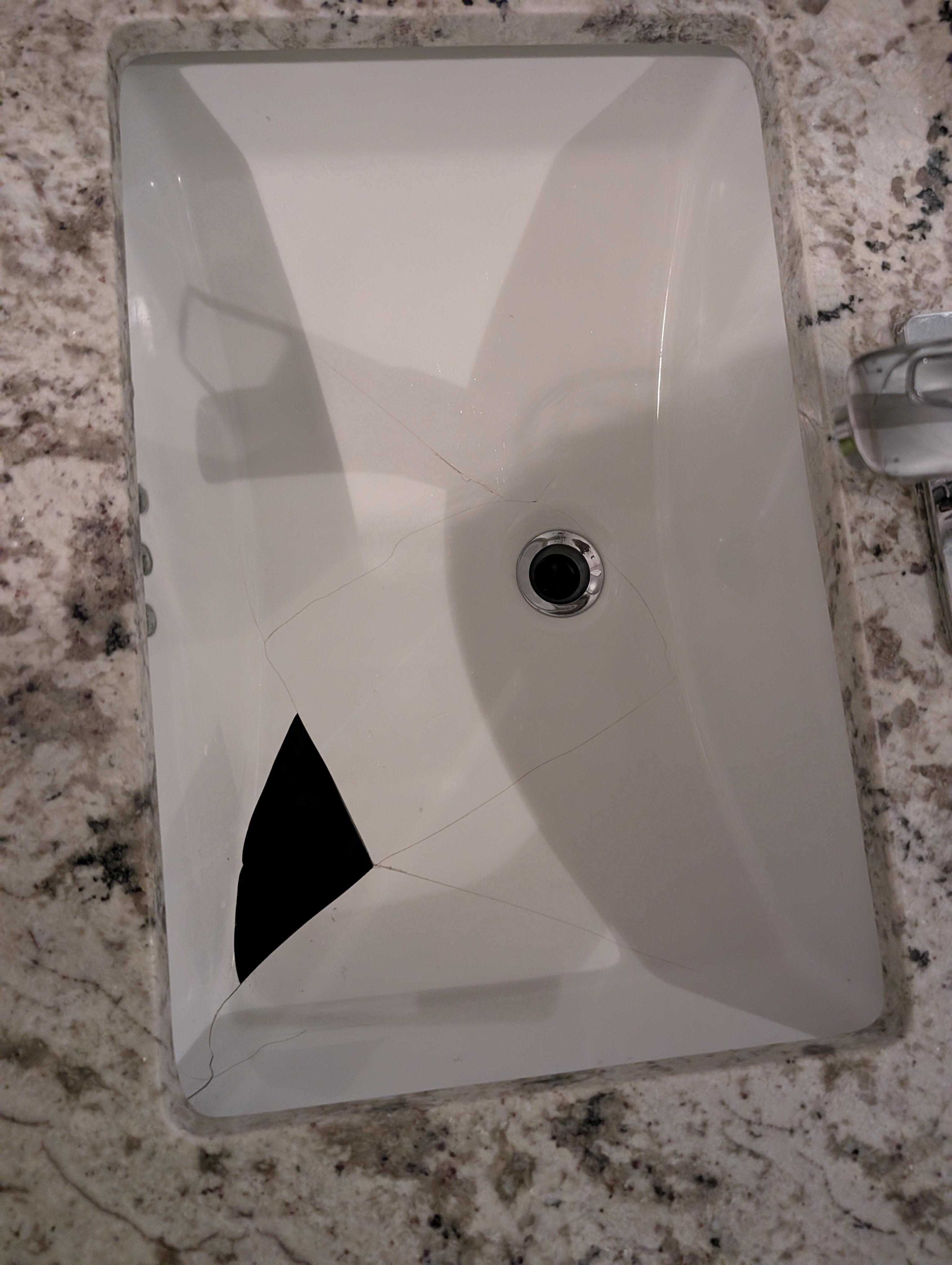Sink with a missing piece There was another one next to it that was fine
