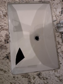 Sink with a missing piece There was another one next to it that was fine