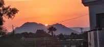 Sun set over the hills which is they view from the balcony