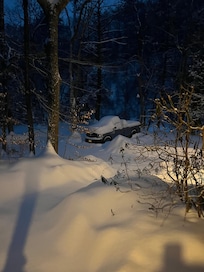 Well plowed driveway with private parking area.