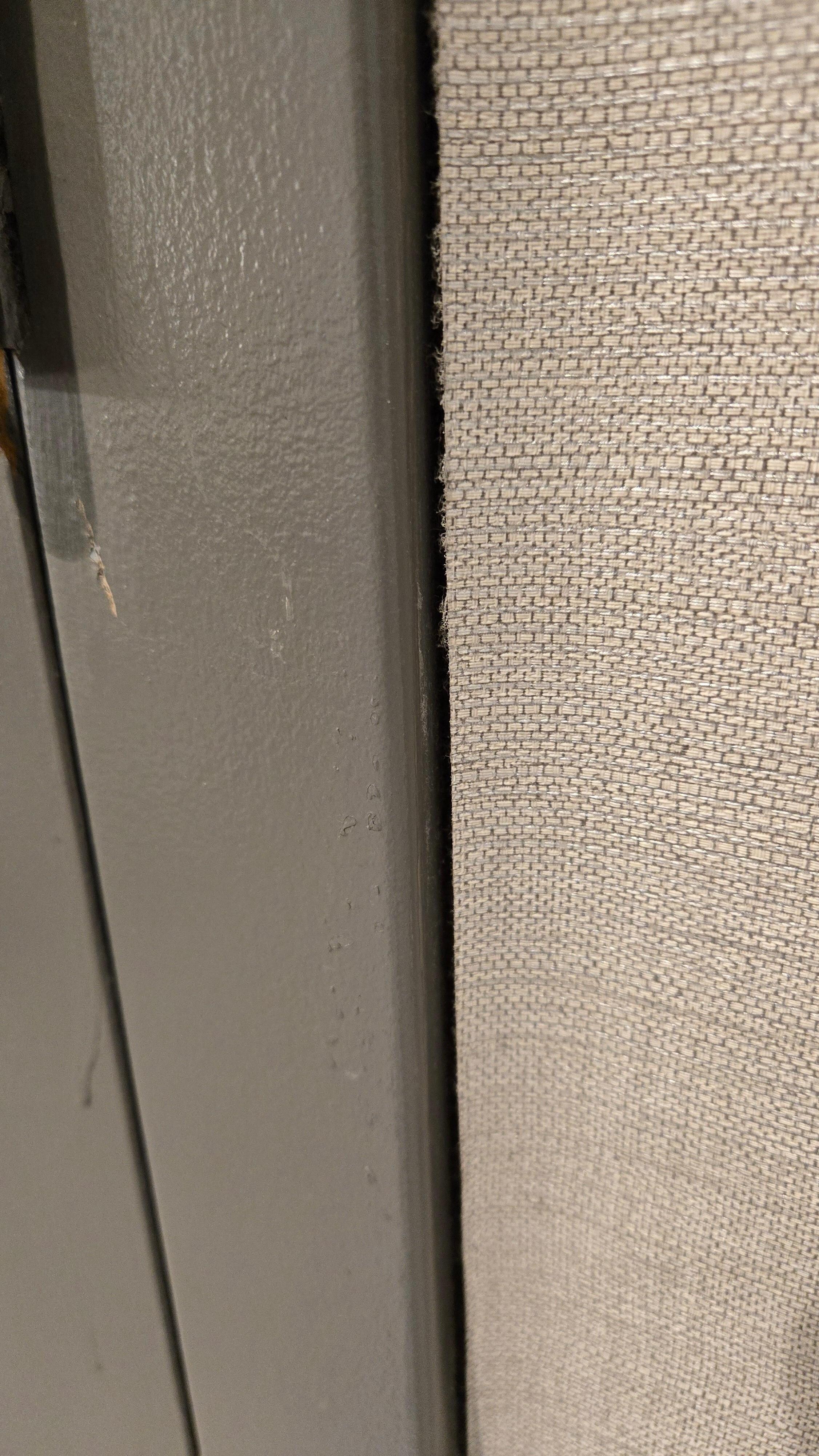 The wallpaper peeling off. 