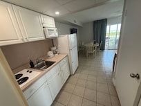 Kitchen and bathroom door on right