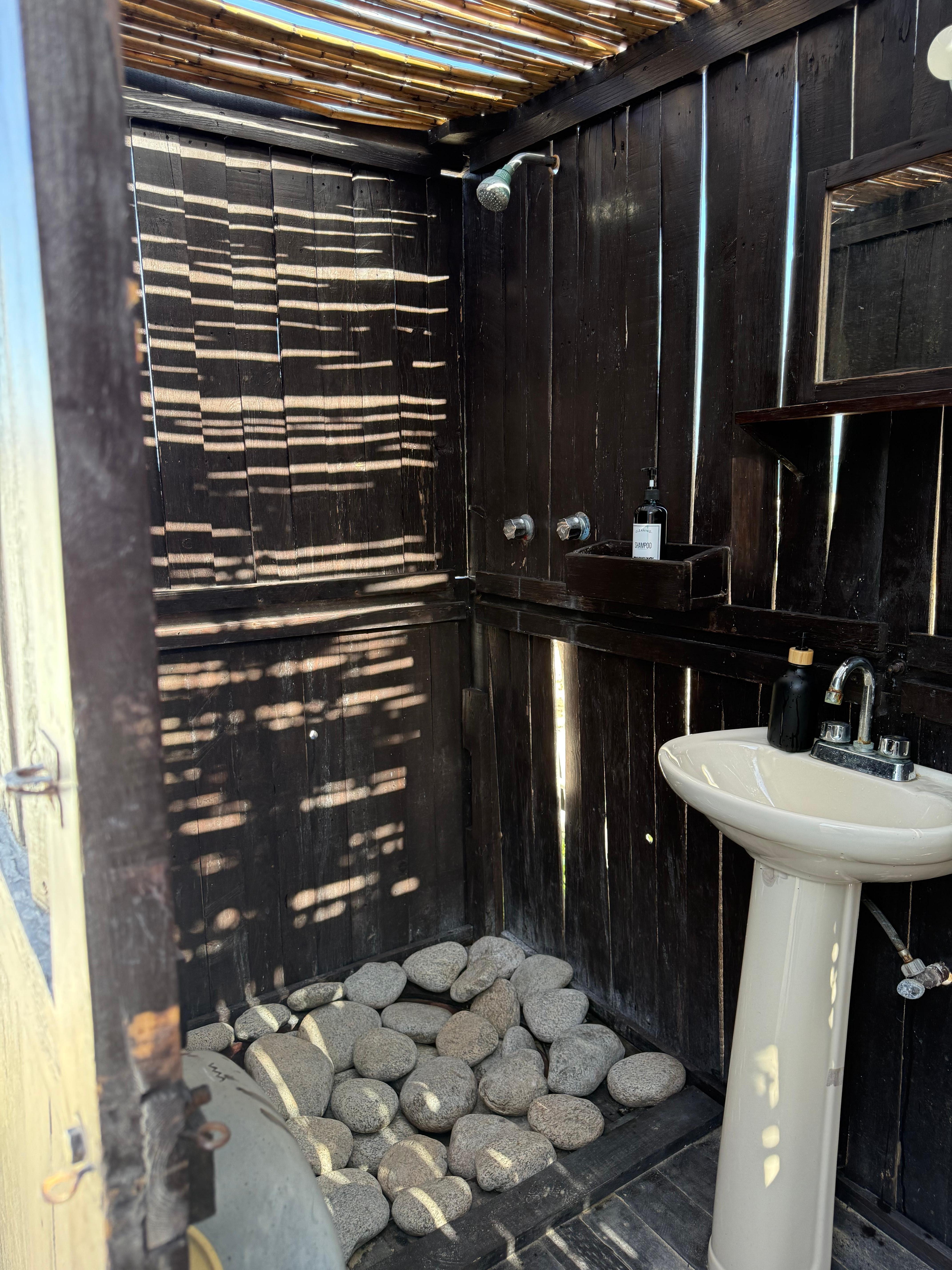 It’s a bit of a trick to stand on the rocks and shower. But the shower was awesome. 