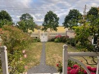 The house is on a quiet road overlooking fields to the front.