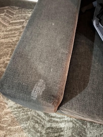 Nice large white stain in the arm of the sofa