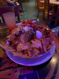 If you go to the restaurant, Margaritaville on the 2nd floor, the Volcano Nachos are a must try!!