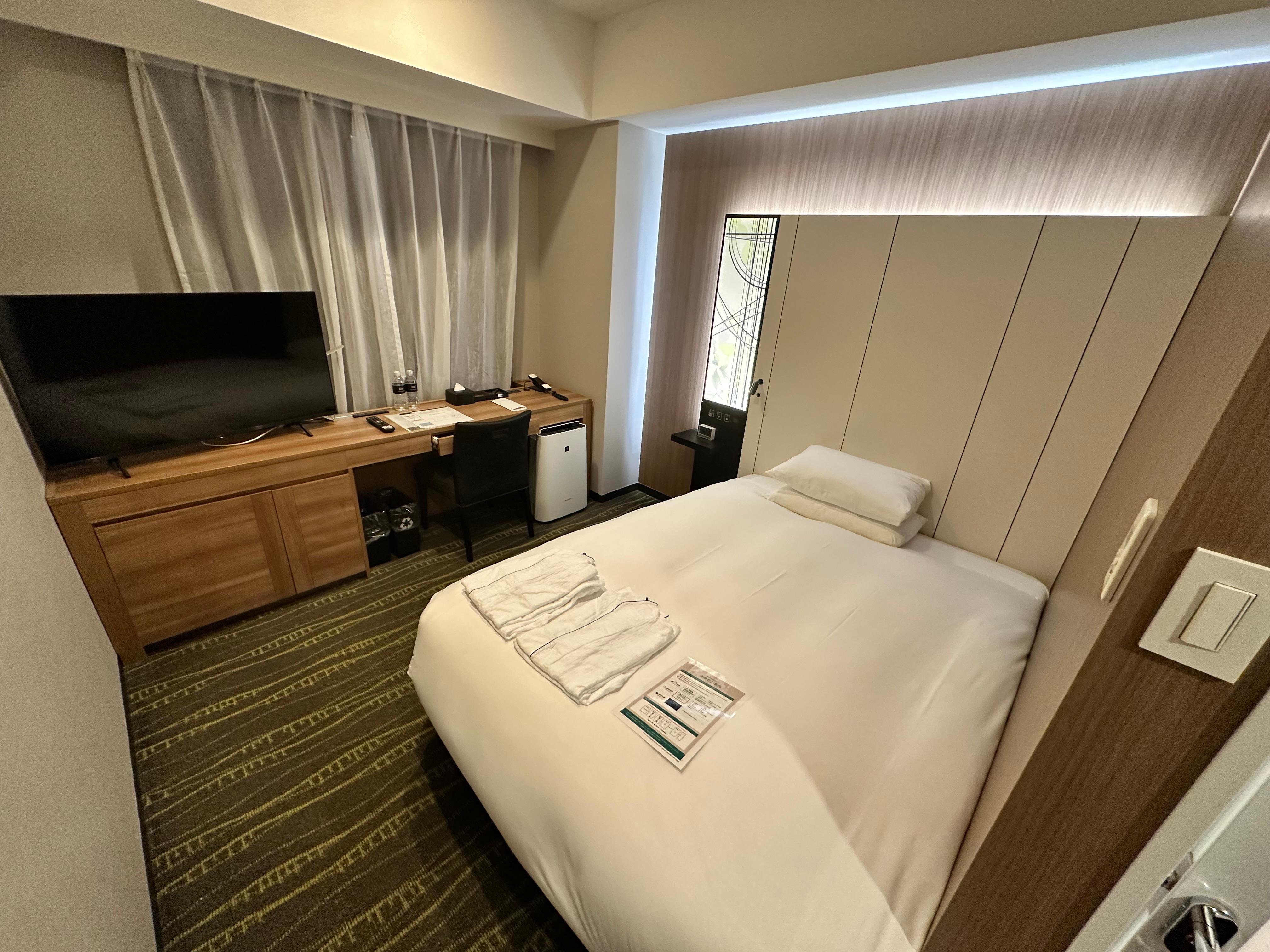 Attractive room, but bed against wall and no unencombered space to access suitcases not restful or relaxing