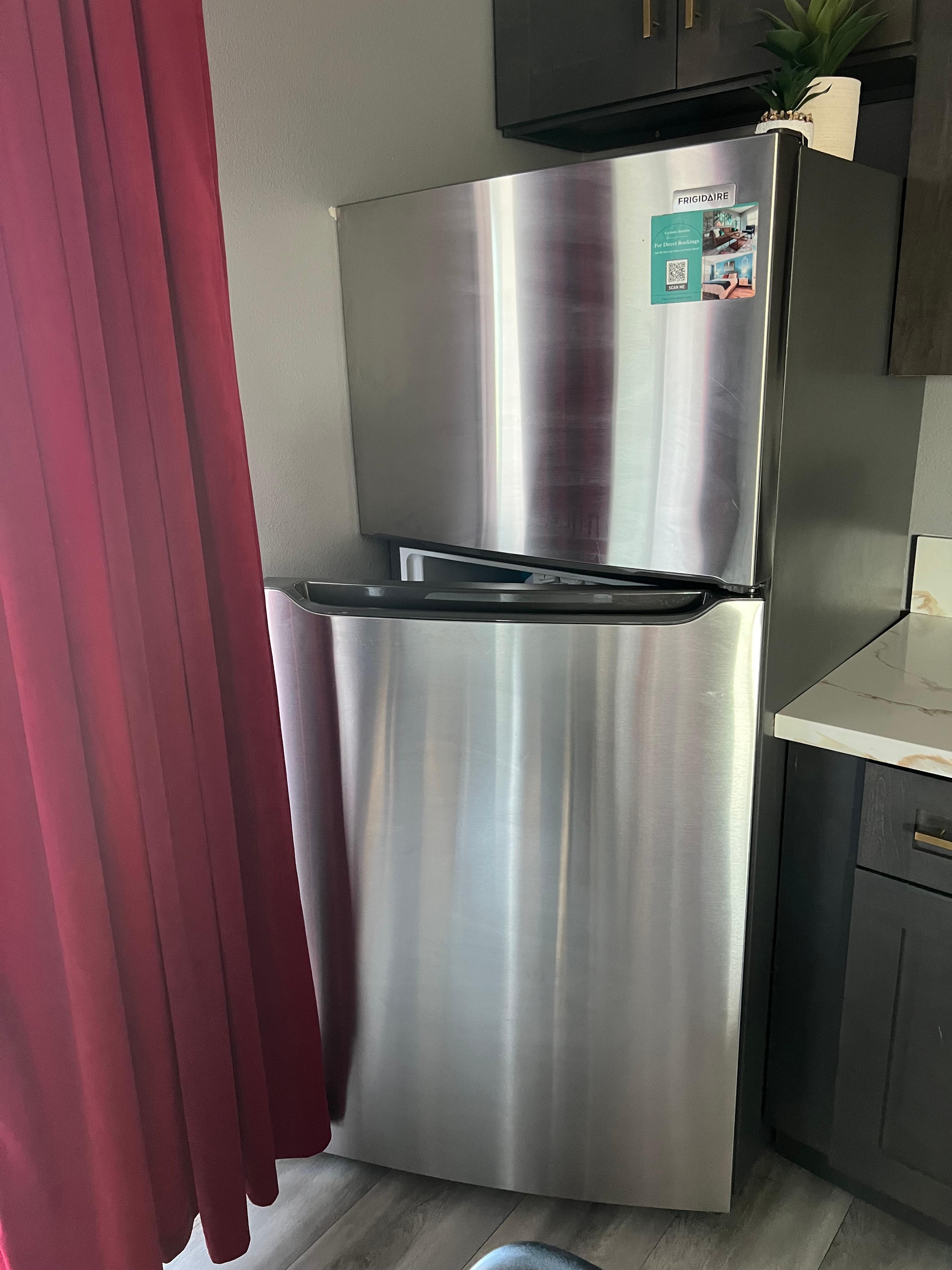 Fridge opens into a wall.