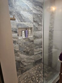 No shower door so water poured out onto the floor creating very slippery surface. Had to pile up all our towels to soak it up.