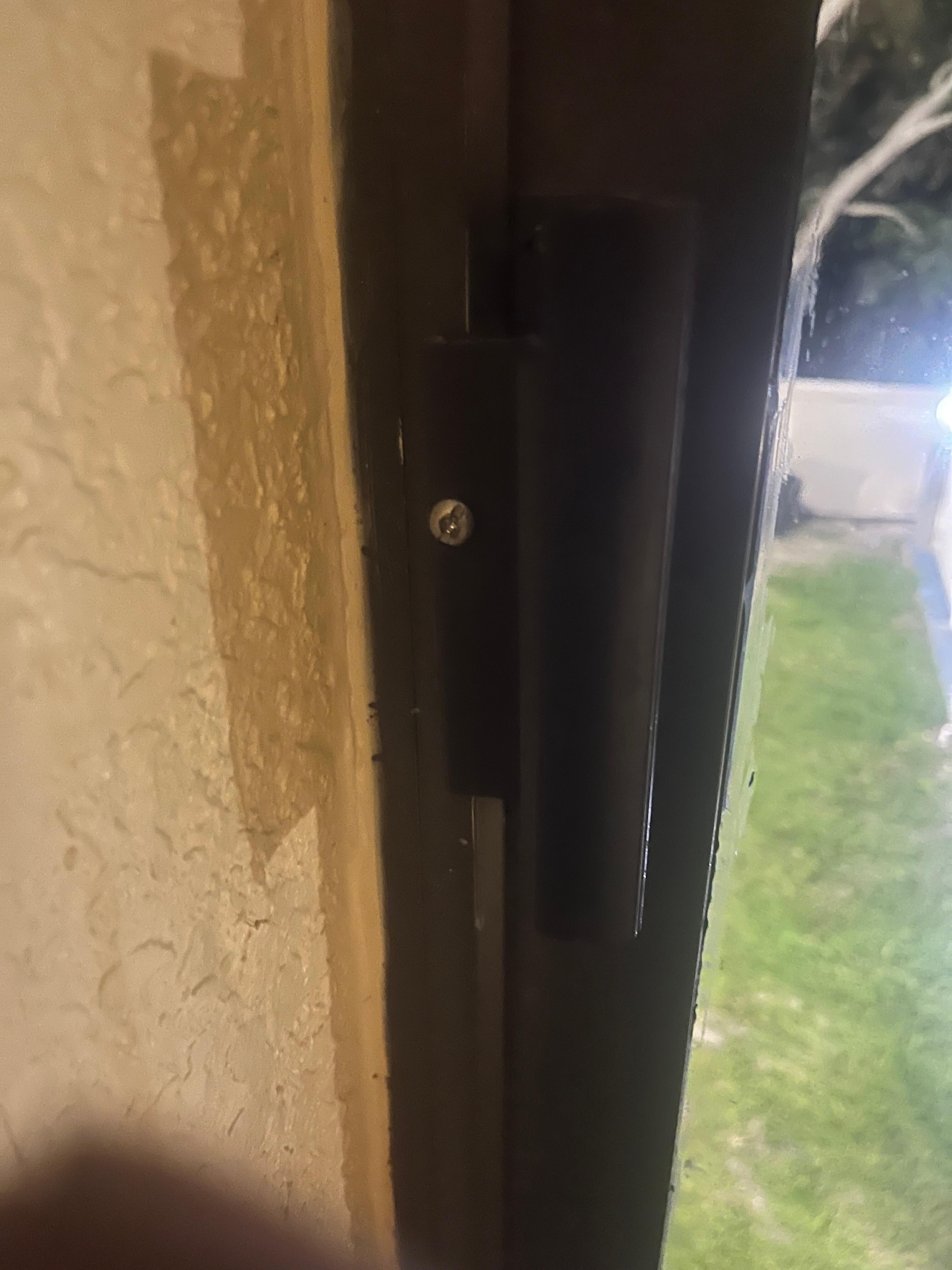 The screw to keep the window closed