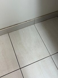 Lotion/soap on wall and floor