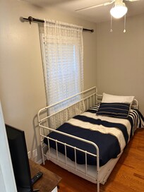Bedroom with twin bed. Gets really hot in this room