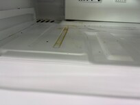 Gunk and sticky slime inside refrigerator