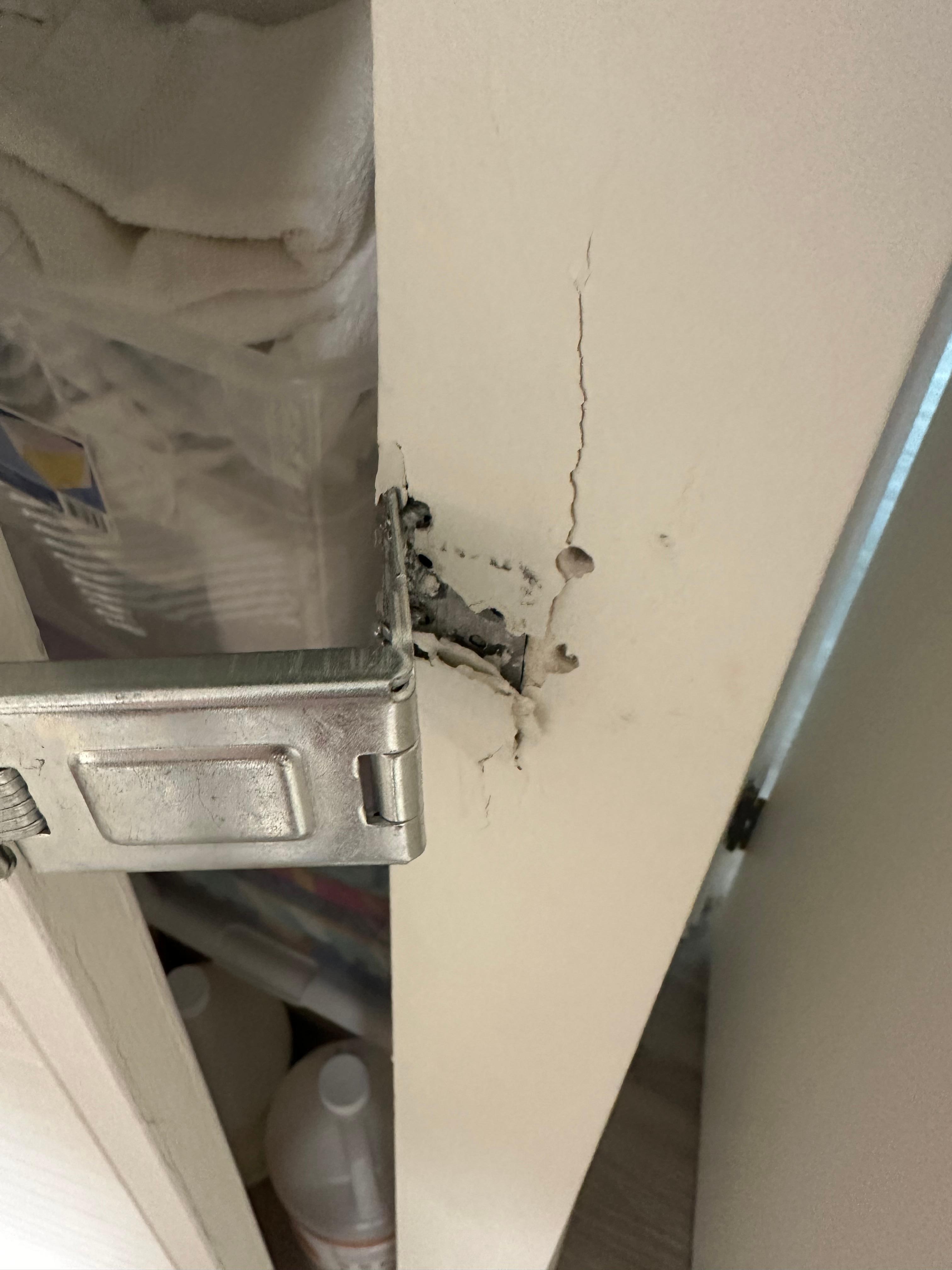 Closet with a lock that was falling apart.