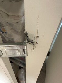 Closet with a lock that was falling apart.