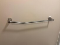 Broken towel bar in the second bathroom.