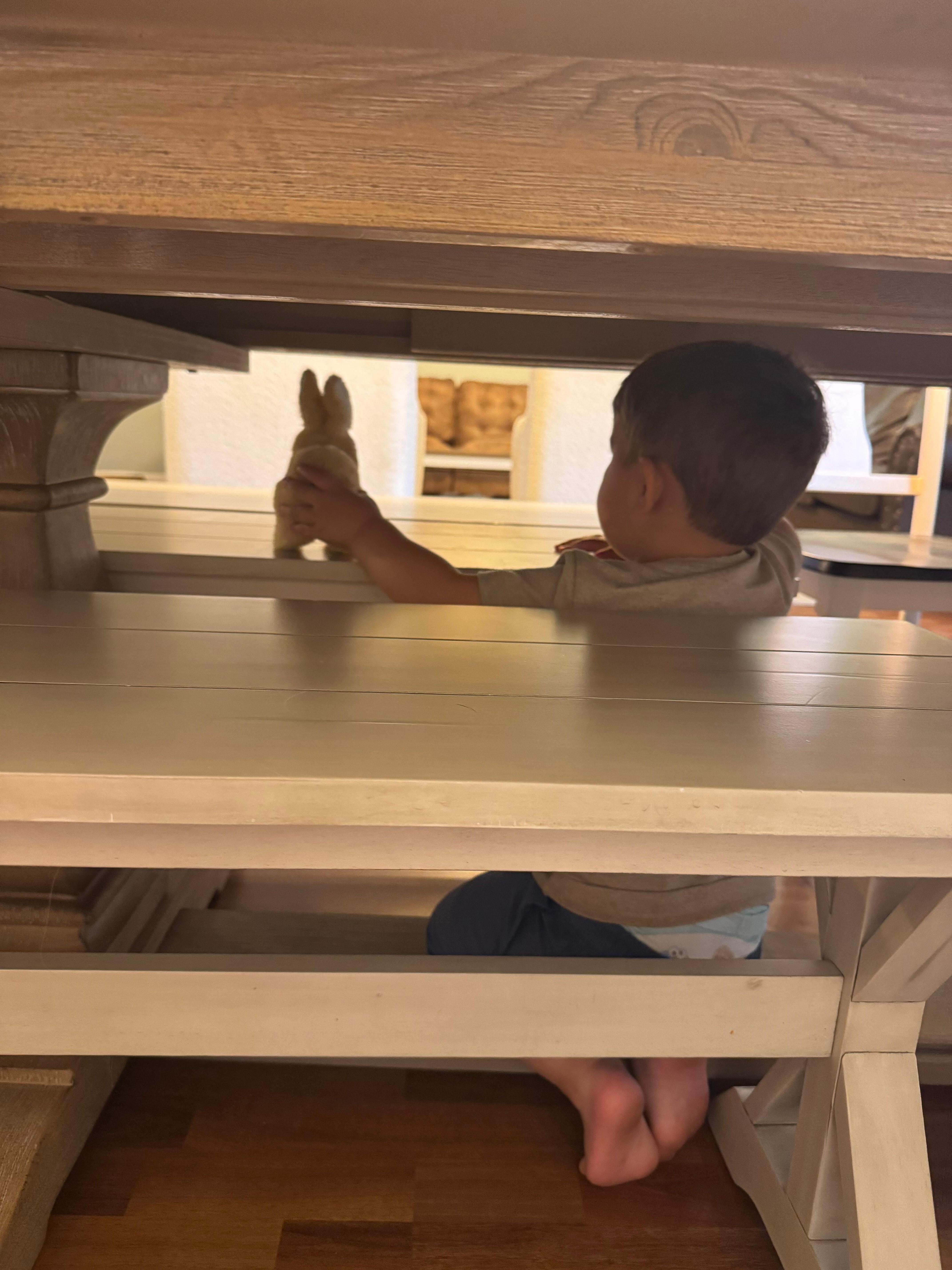 my cute grandson playing under the table
