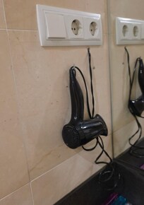 Ohne Anwendung überhitzte Fön - Brandgefahr wurde von Personal missachtet