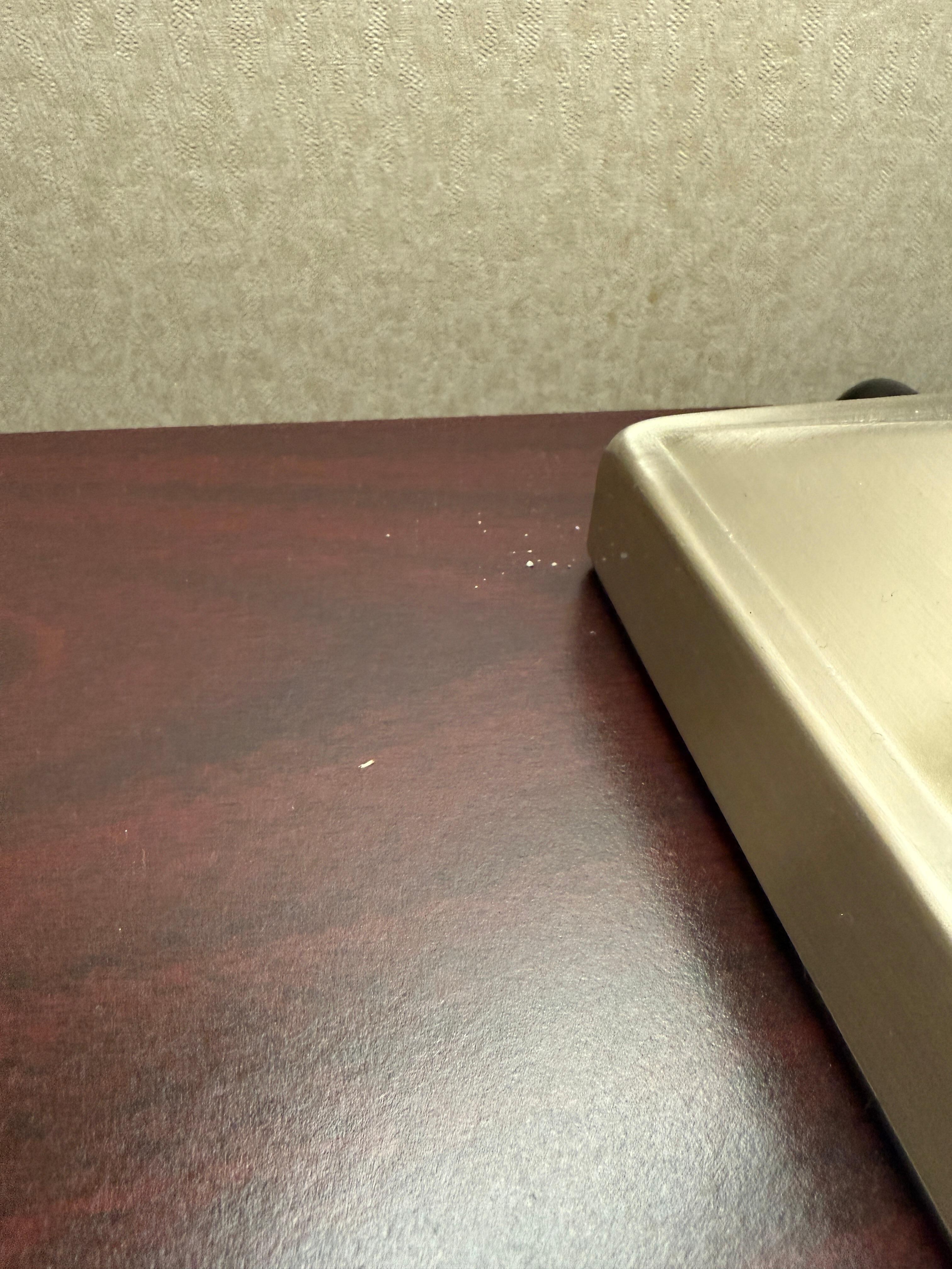 The dirt/debris on the night stand as I look around.