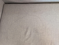 Stained dirty sofa bed