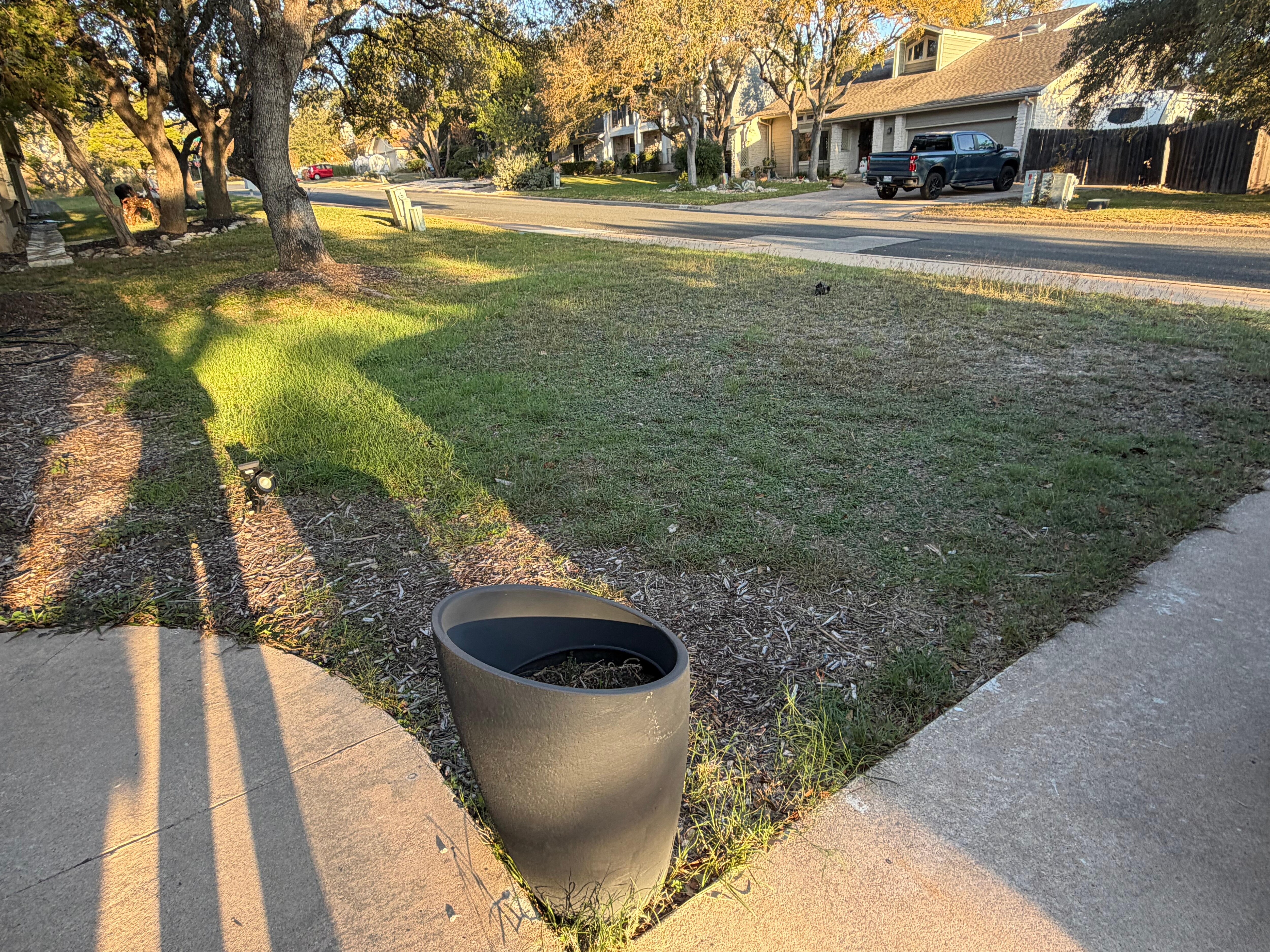 Front yard. The driveway lights did not work and one was laying in the yard.