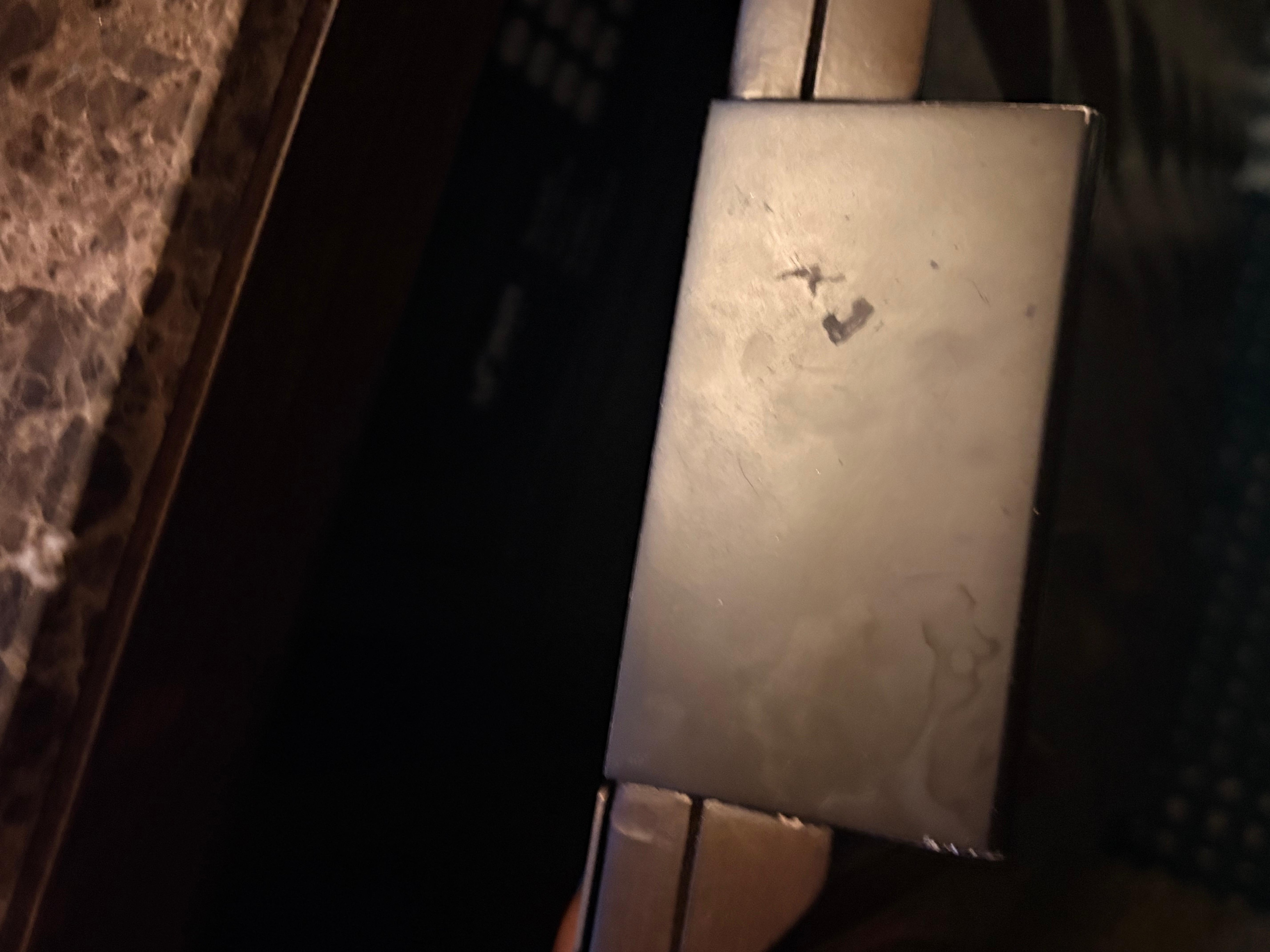 Handle on the cabinet that contains the fridge