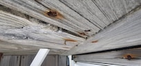 Deck falling apart
Nail heads causing injury.