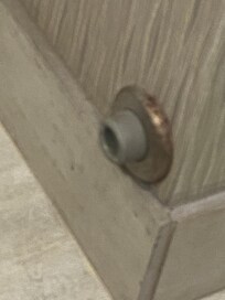 Rusted door stop dirty.