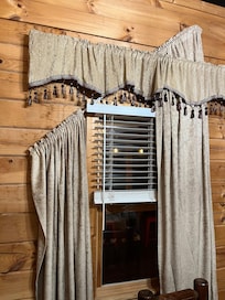 Broken and filthy window treatments throughout.