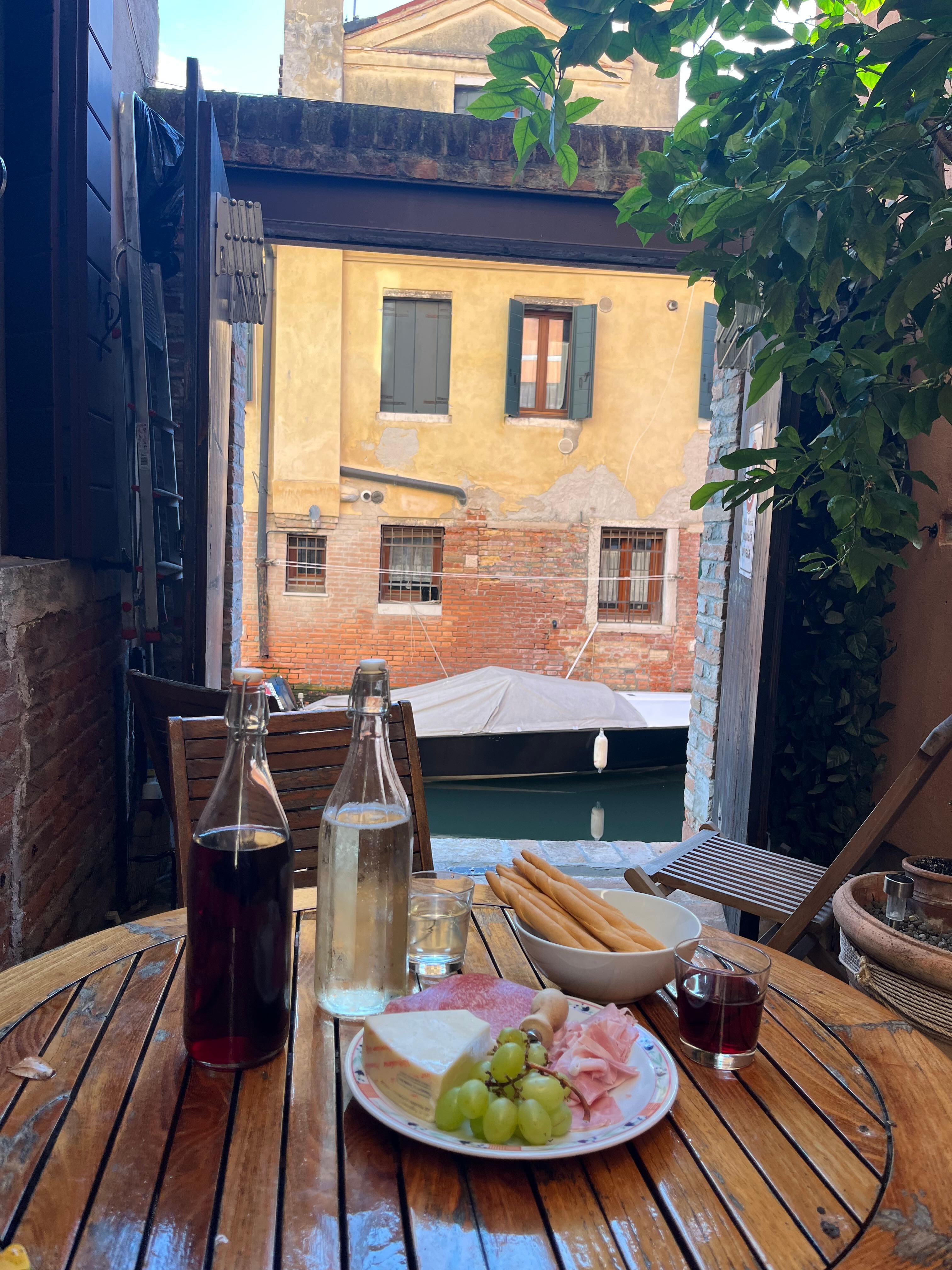 Courtyard on the canal with wine from the cantina 