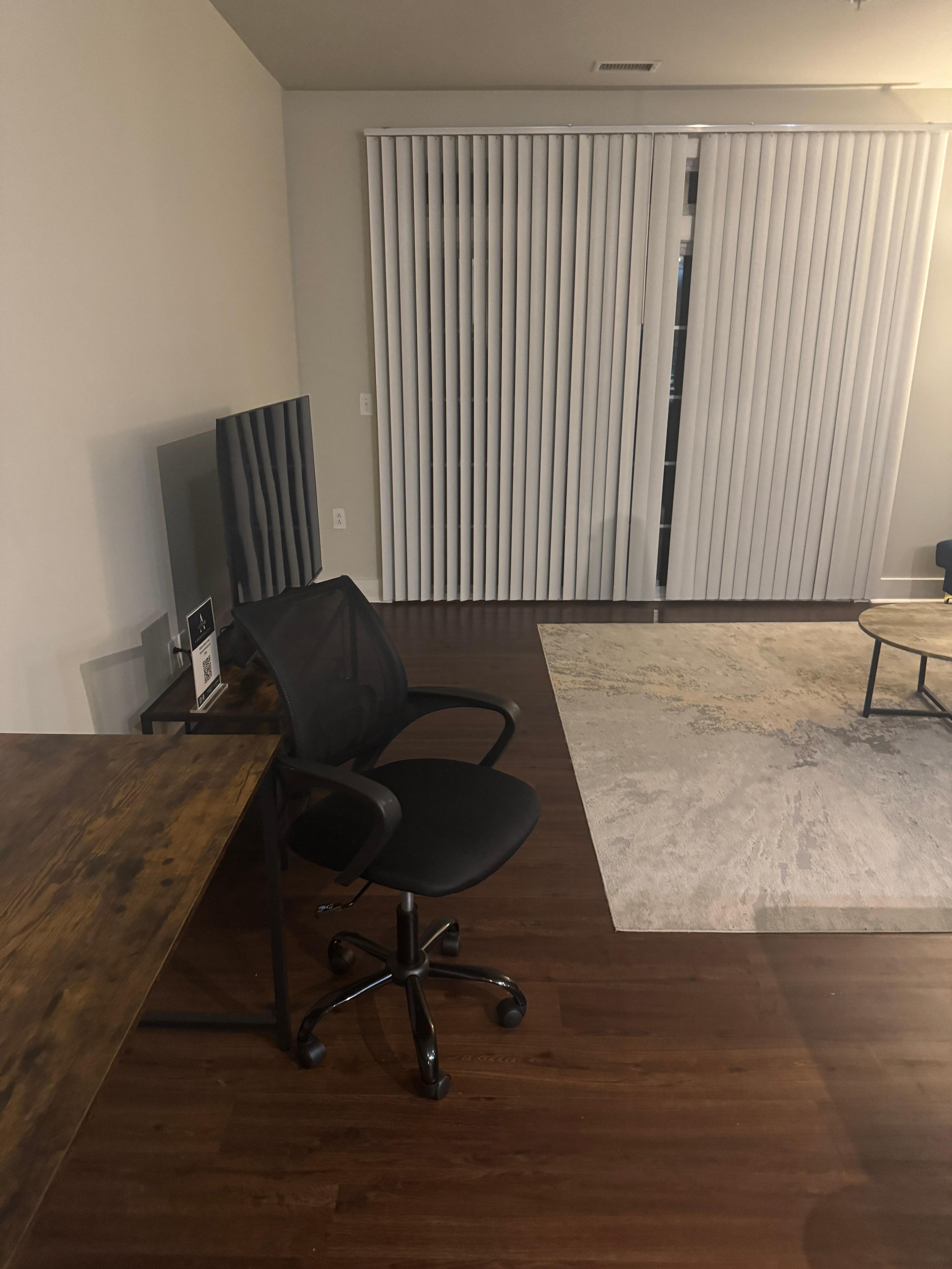 Living room. Missing blind. Window faces active park lot