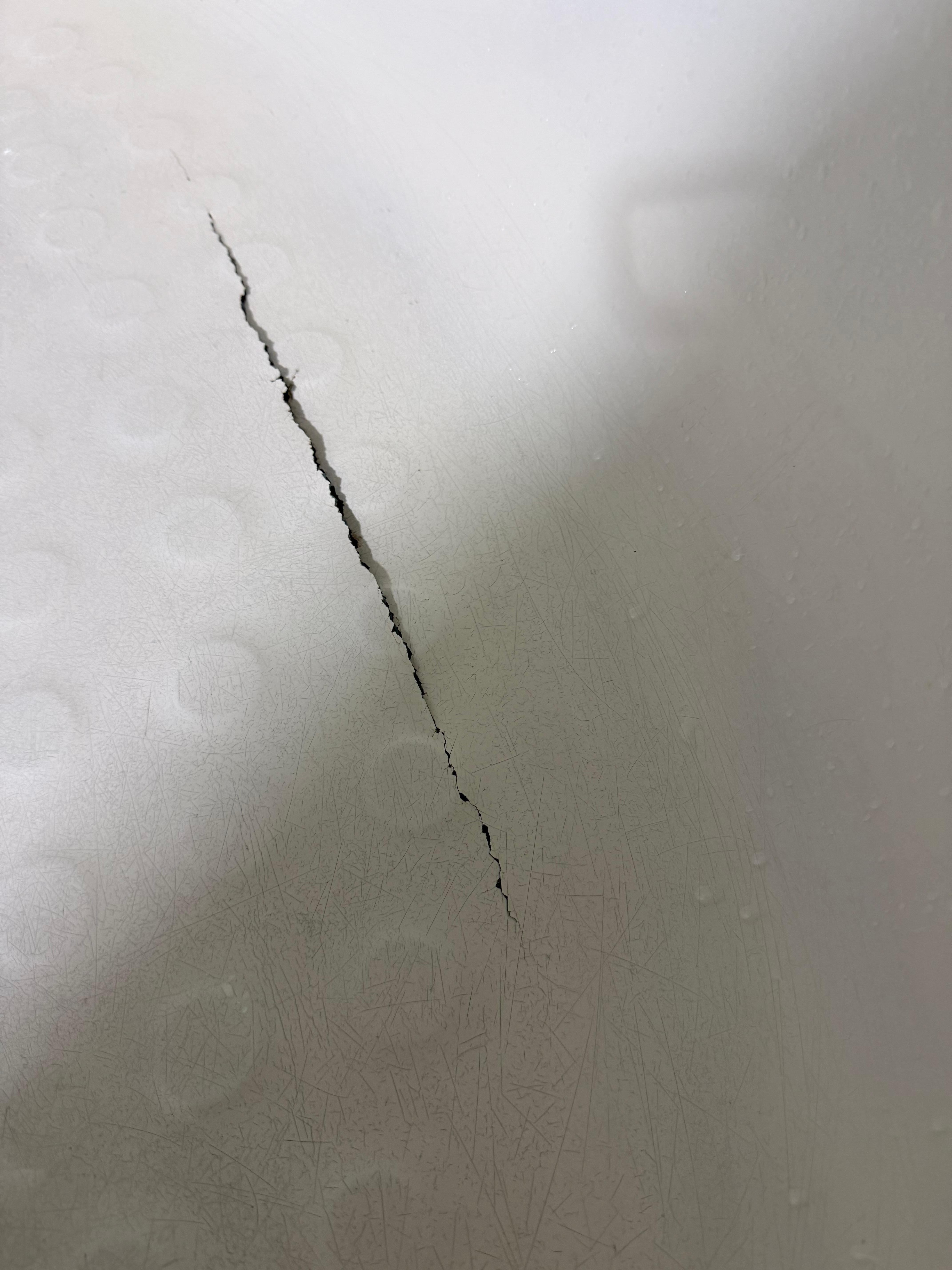 This was the hole in the tub, unsure where the water was going, possibly the insurance office under . 