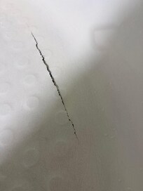 This was the hole in the tub, unsure where the water was going, possibly the insurance office under .