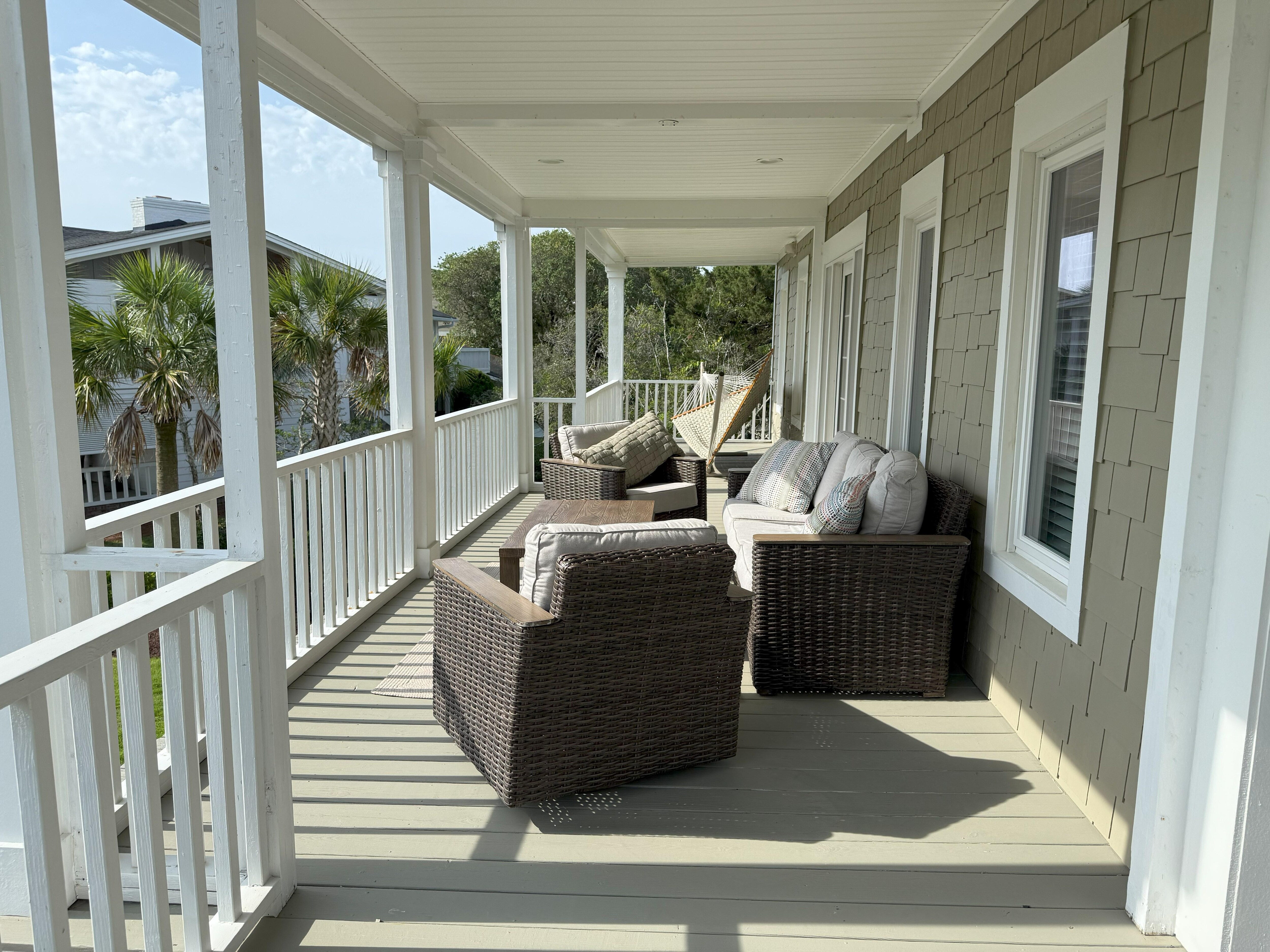 Another section of the porch on the second floor. So many comfy options!