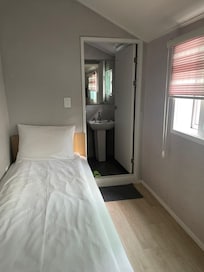 Single room with good view of neighbors cleaning their beautiful balcony.