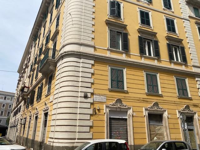 Outside of the apartment building, which has a nice central courtyard and a service elevator. 