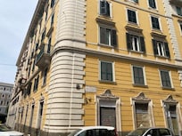 Outside of the apartment building, which has a nice central courtyard and a service elevator.