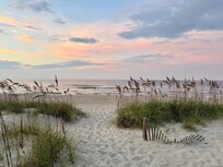 Sunrise walking onto beach