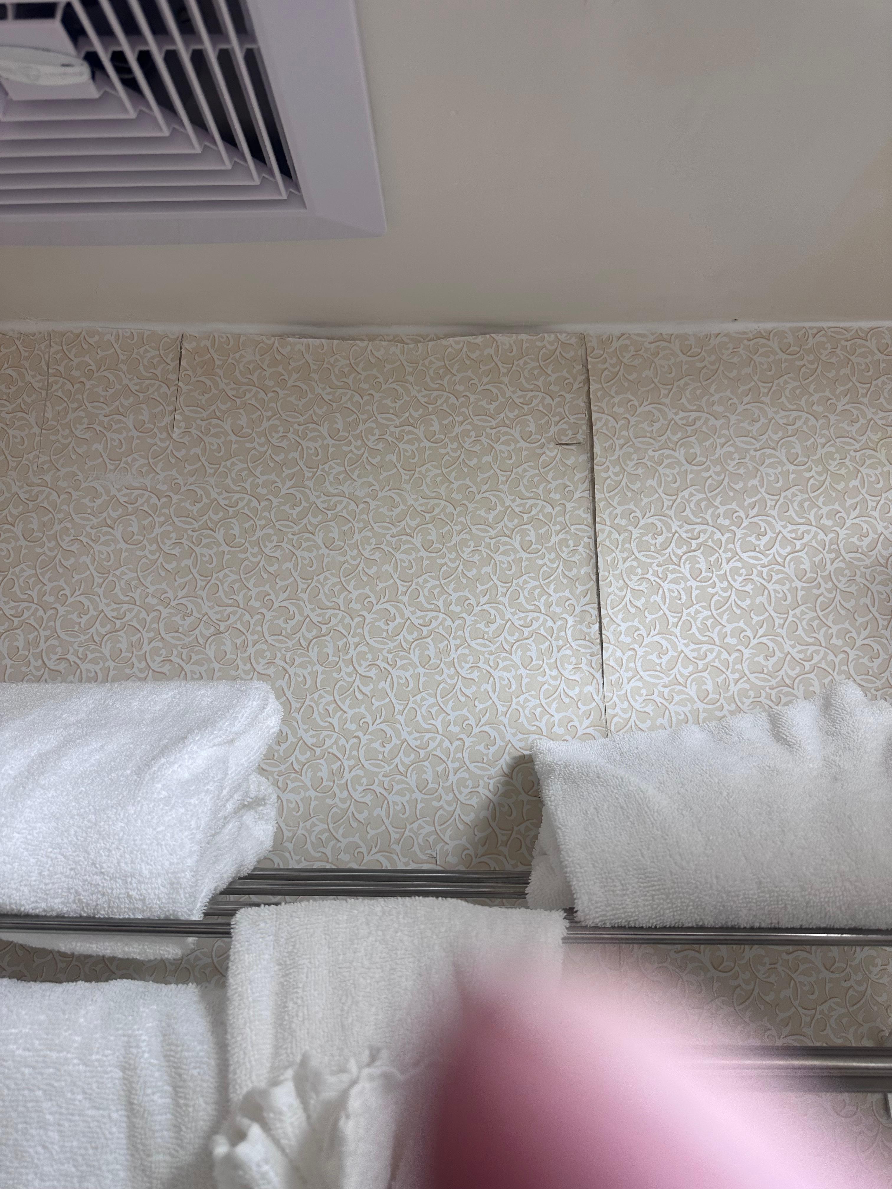 Wallpaper peeling in the bathroom