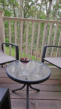 Back deck view and has a BBQ