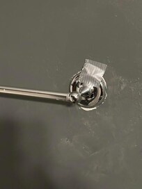 how the towel rack was "secured" in the upstairs bathroom