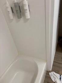 The shower product that drip down the wall and along the end of the tub cause a dangerous fall risk