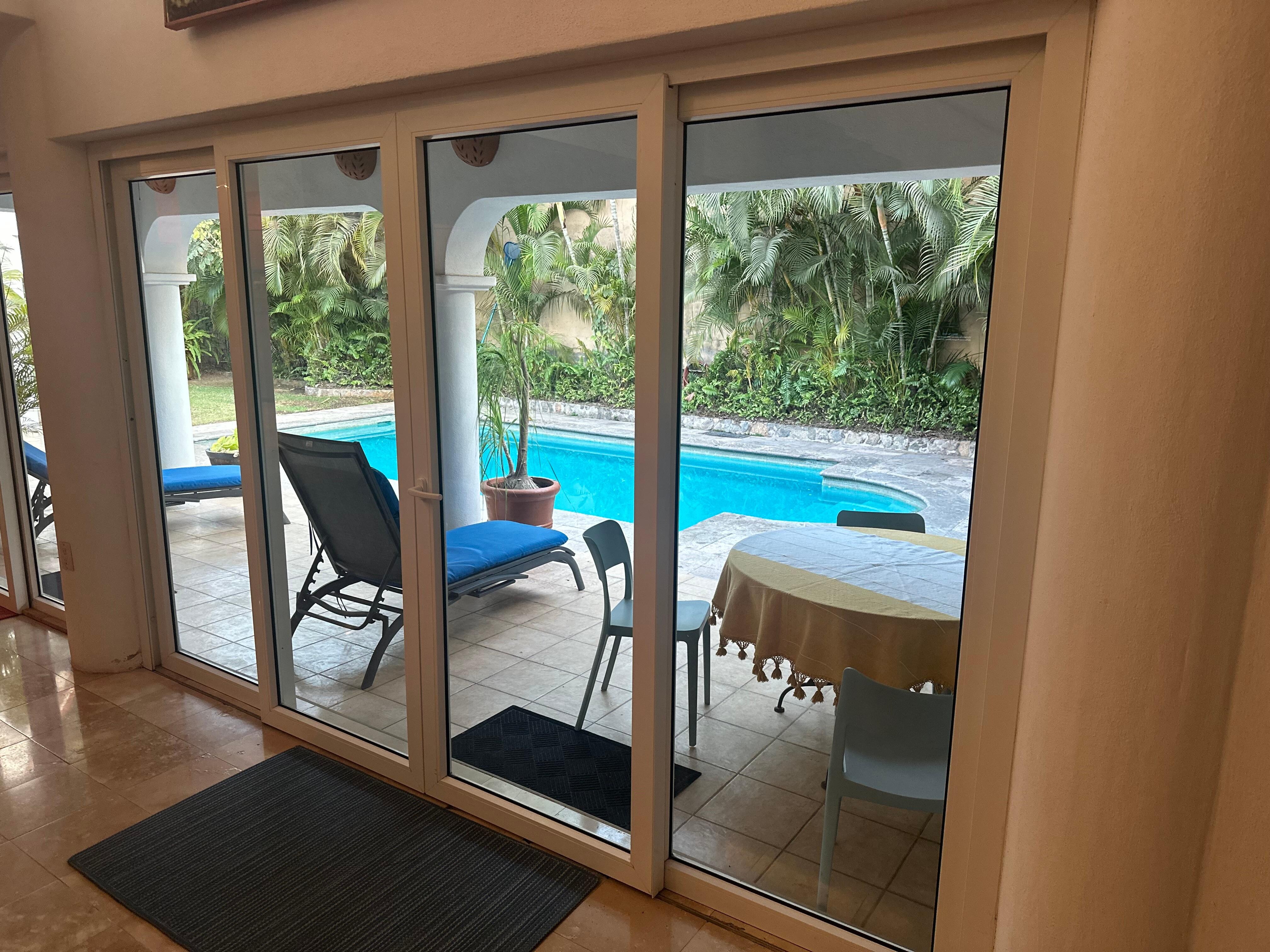 View from couch area out to the pool