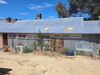 The room with its closed in verandah
