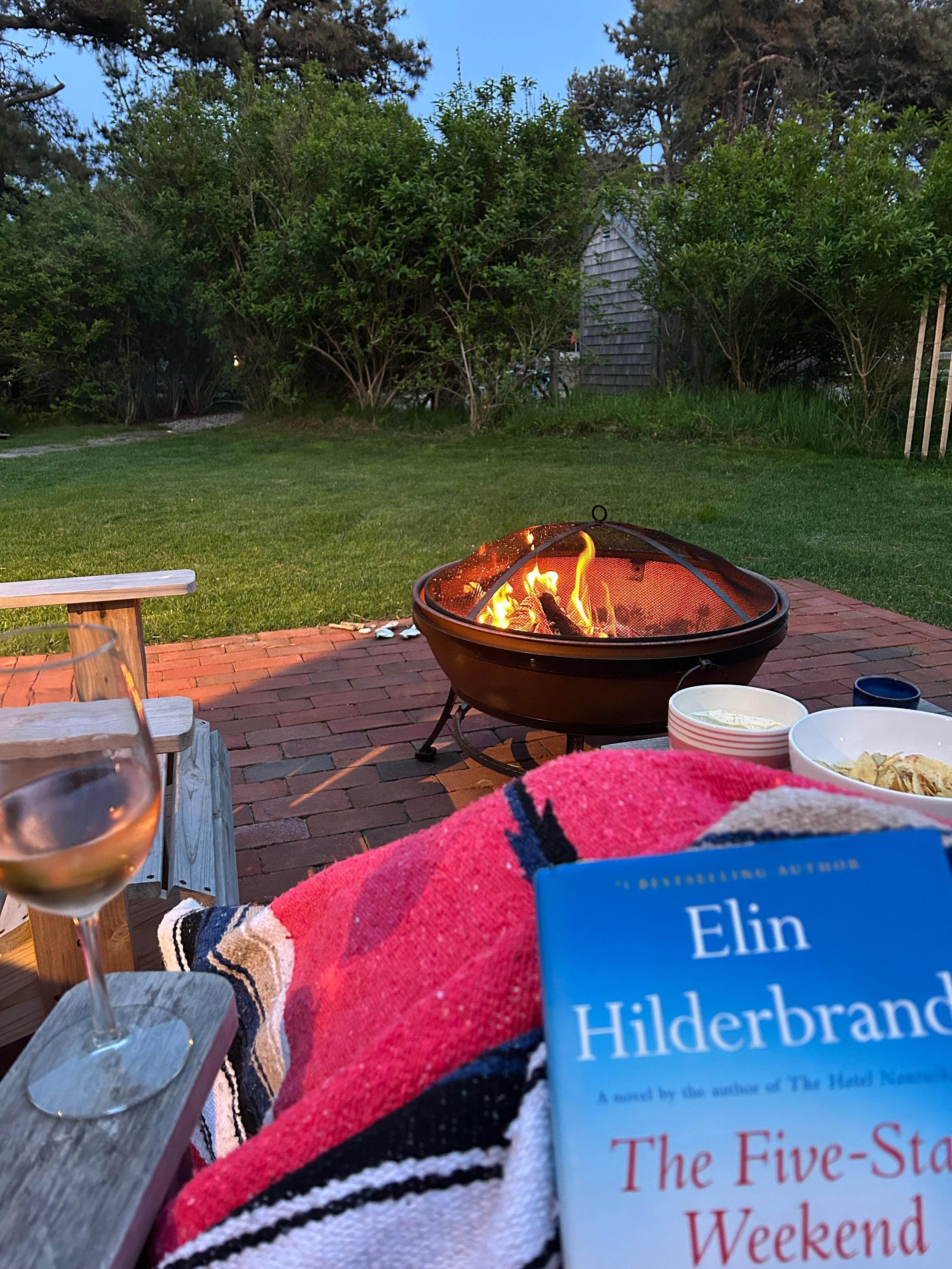 Enjoying the firepit and Adirondack chairs in the yard! 