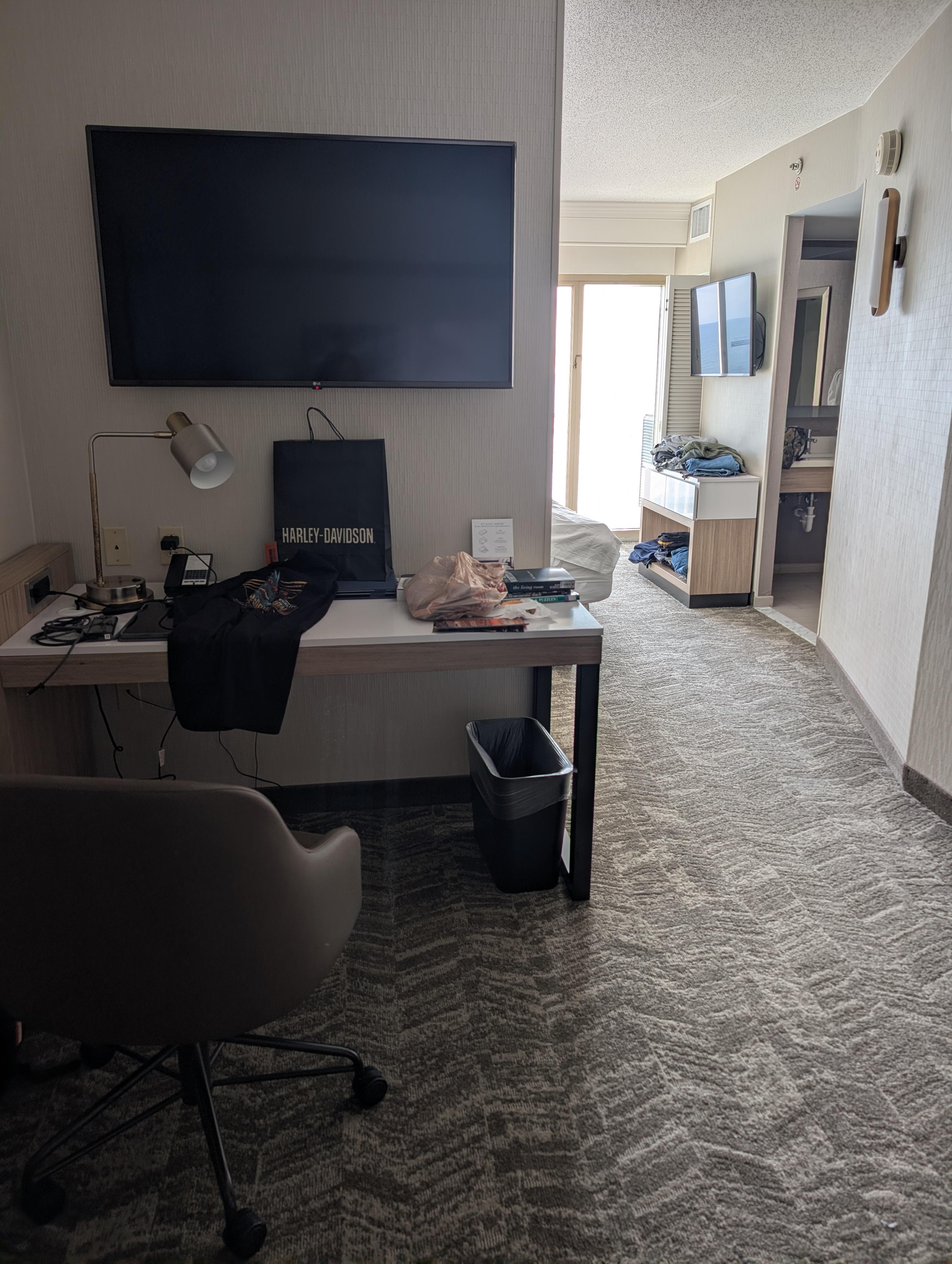 2 tvs in the room and a desk to work at
The couch was a trundle bed