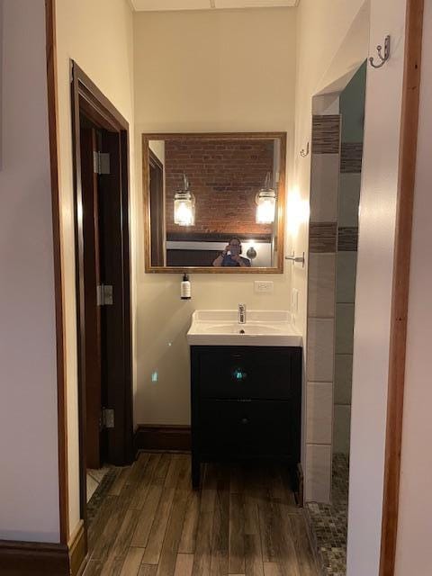 Vanity, toilet on left, shower on right.