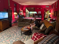 This room had a record player, game machine with all the games from 80s, 90s. It even had Atari games, space invaders, donkey Kong country. TV had all the streaming abilities.