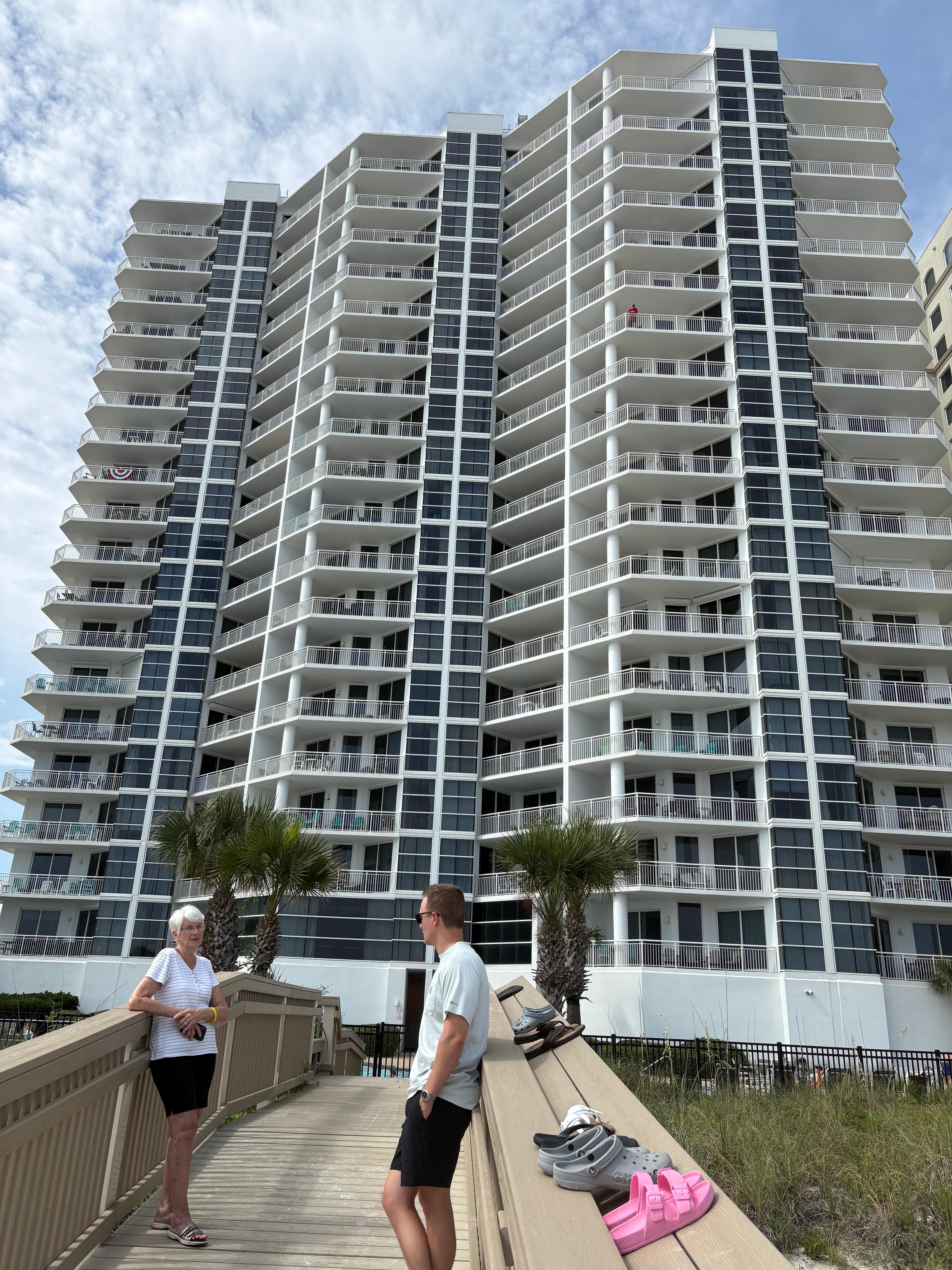 Walking bridge to beach photo of the building 