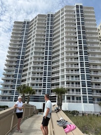 Walking bridge to beach photo of the building